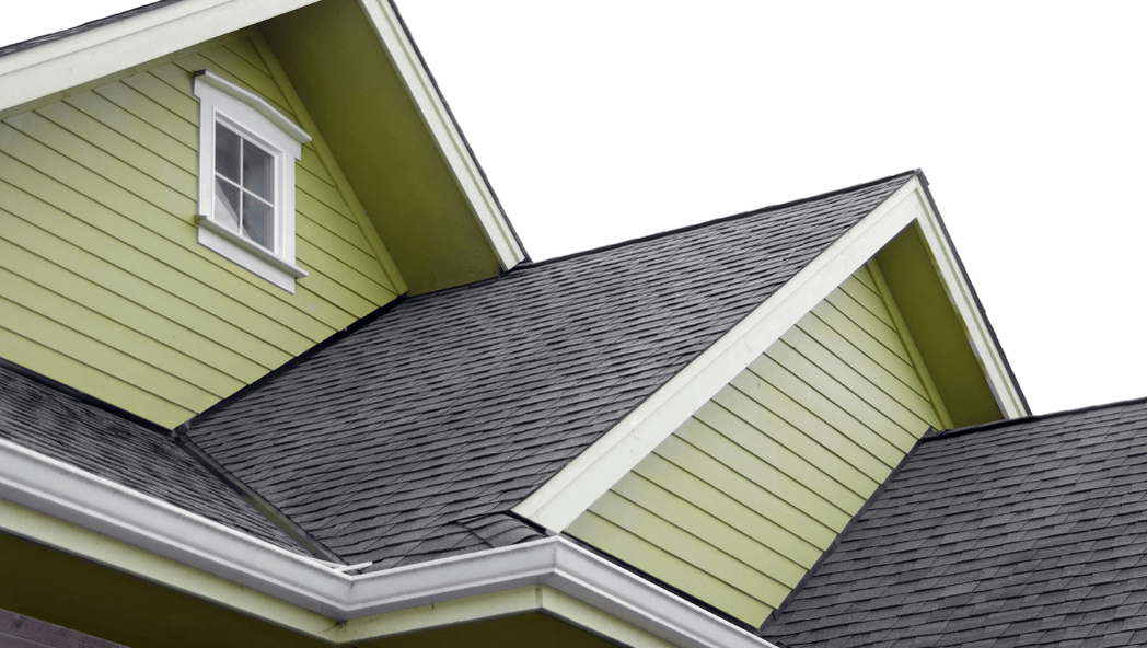 dark gray shingles on a pea green sided two story house